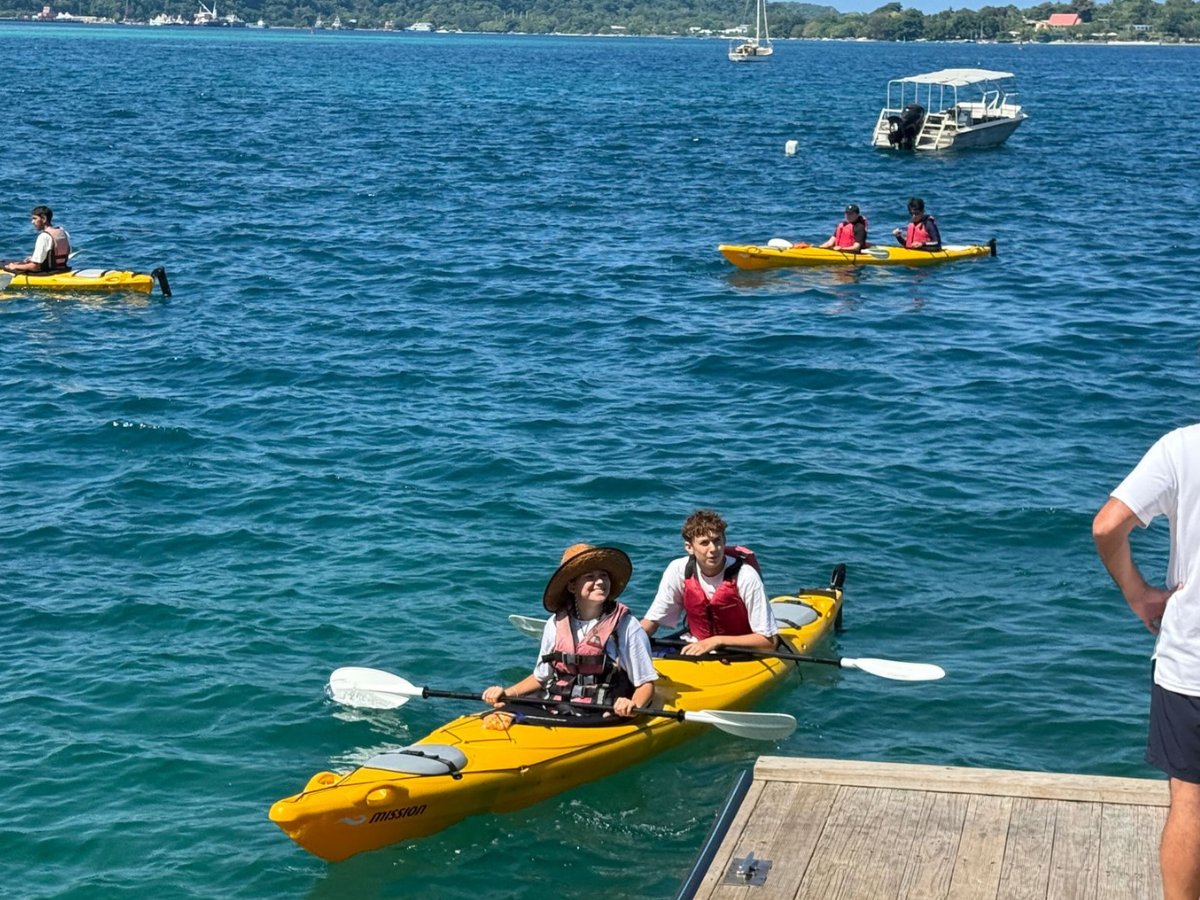 Guests launching yellow kayaks from the Port Vila waterfront