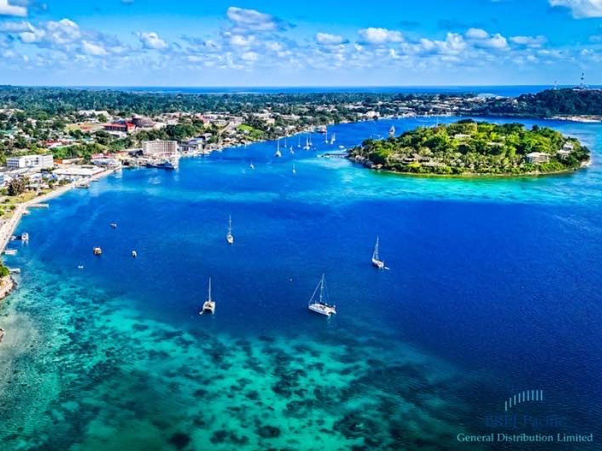 Aerial view of Iririki Island and Port Vila harbour with clear reef water