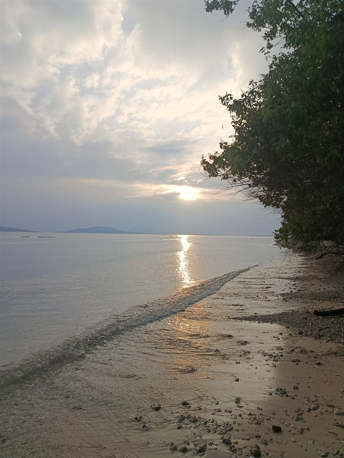 Sunrise over calm water from the beach at Siviri