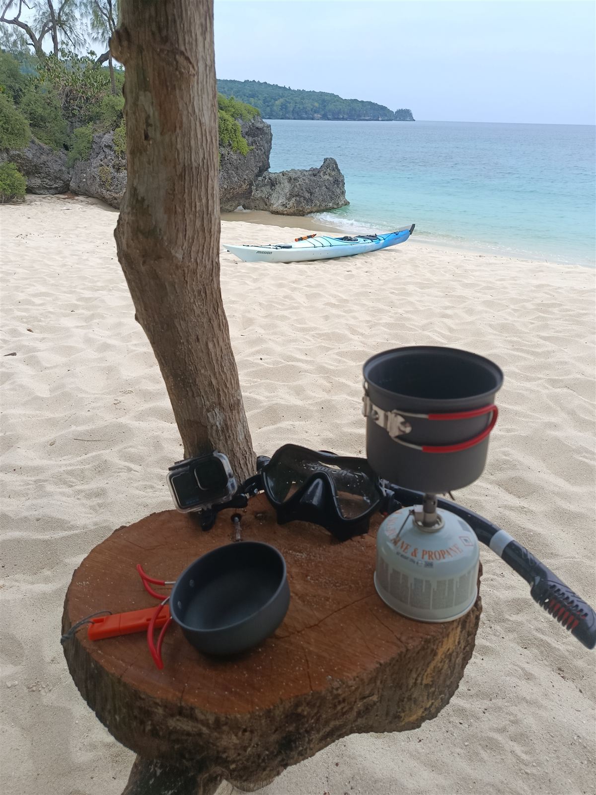 Camp stove and billy on a driftwood table at Hapi Tok Beach