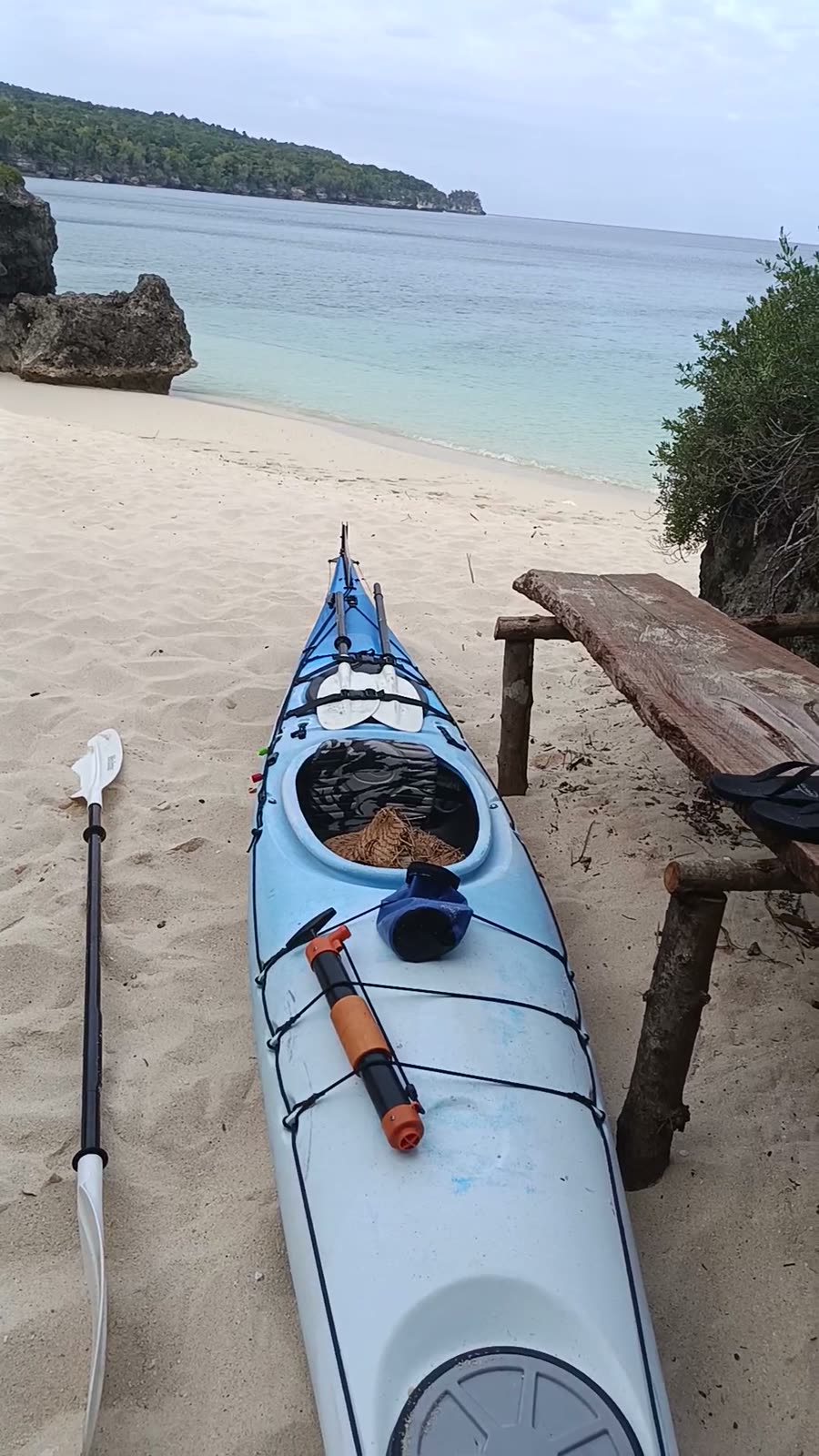 Sea kayak on the white sand at Hapi Tok Beach, ready for the morning paddle