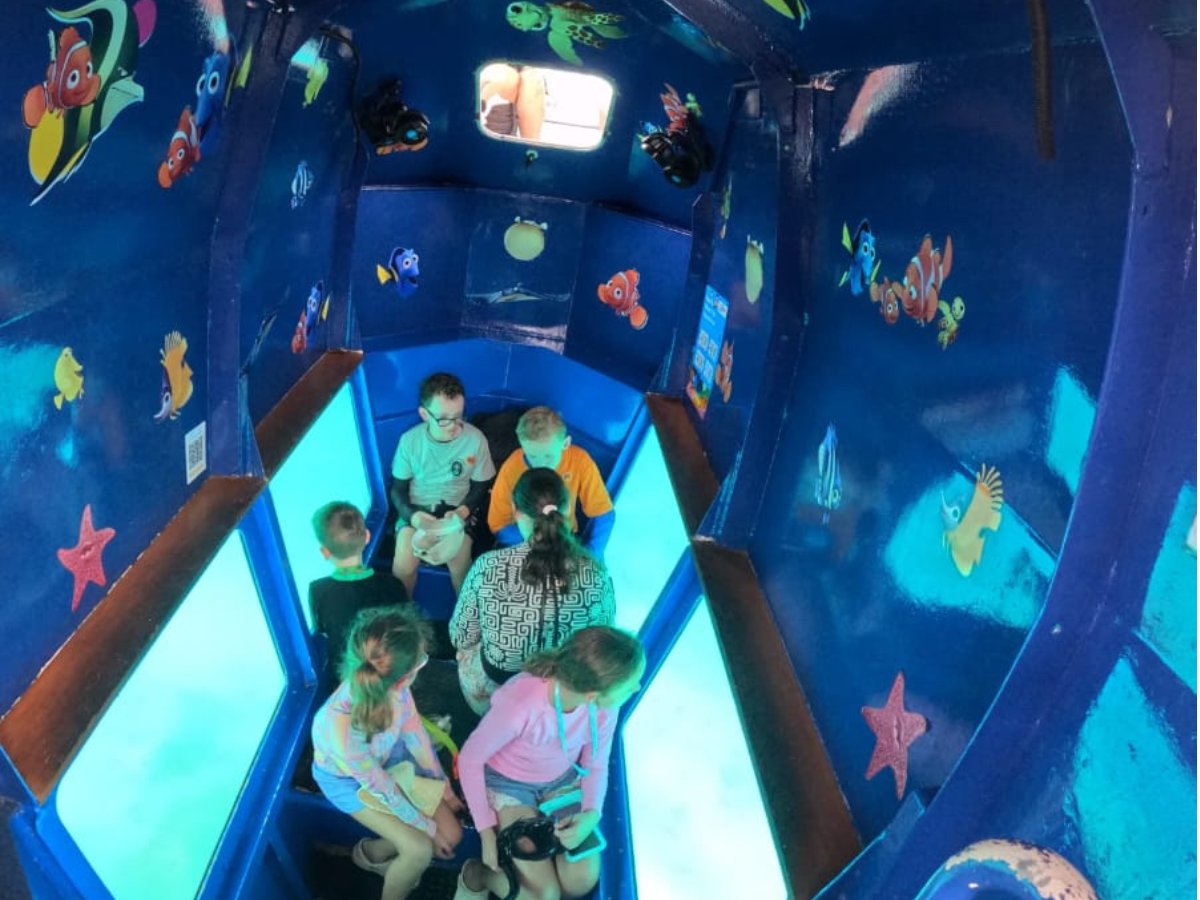 Family enjoying the Reef Explorer underwater viewing cabin