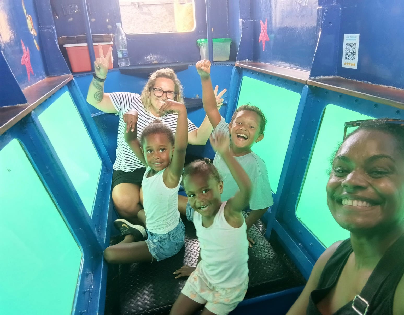 Family enjoying the Reef Explorer underwater viewing cabin