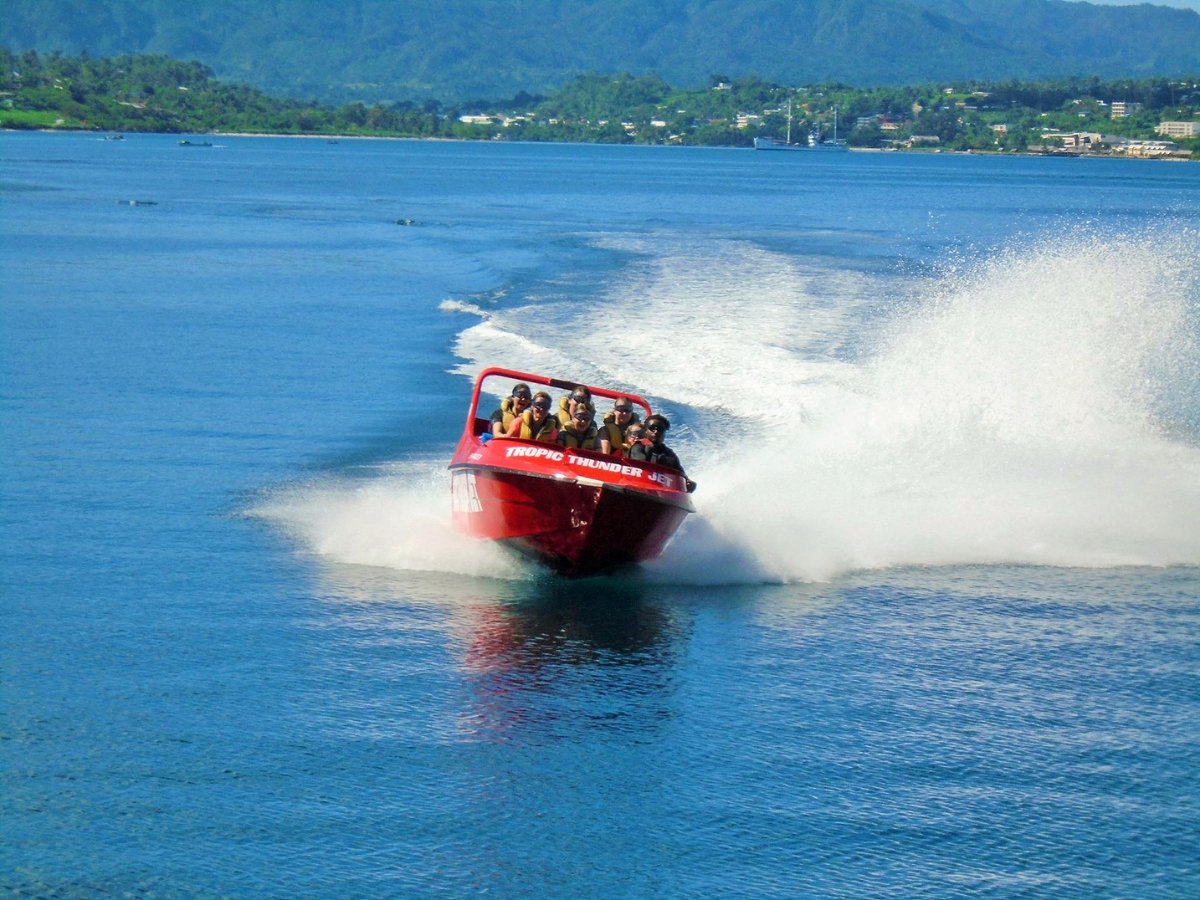 Guests on the Tropic Thunder Jet racing across turquoise water